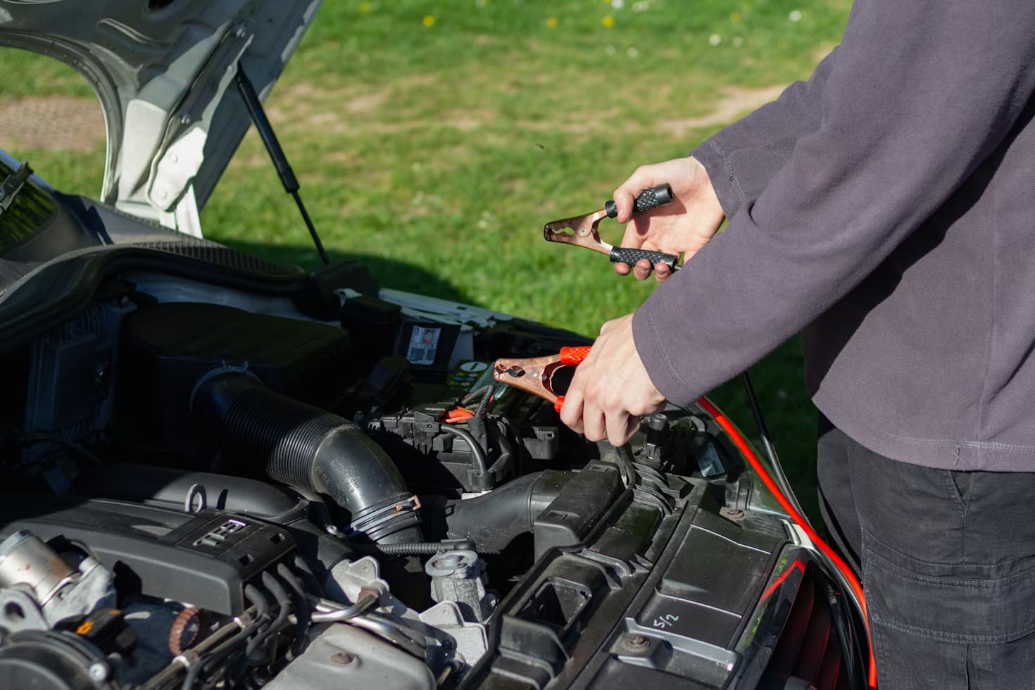 Vehicle battery installed under the hood